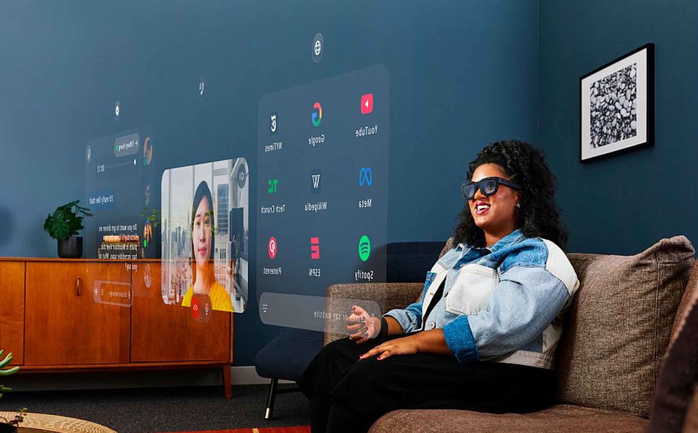 Woman wearing Orion glasses and looking at a holographic screen